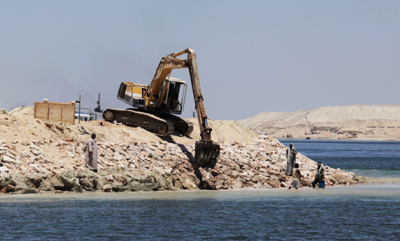 A Bulldozer Works On The New Section Of The Suez Canal In Ismailia 