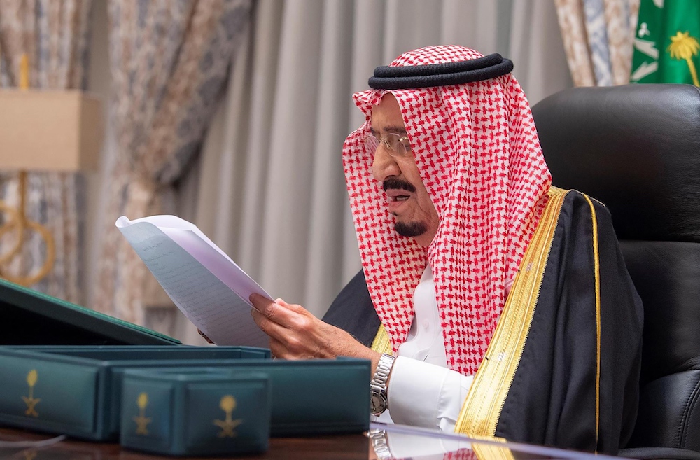  Saudi Arabia's King Salman giving a speech after signing the 2021 state budget during a virtual cabinet meeting in the capital Riyadh. (SPA)