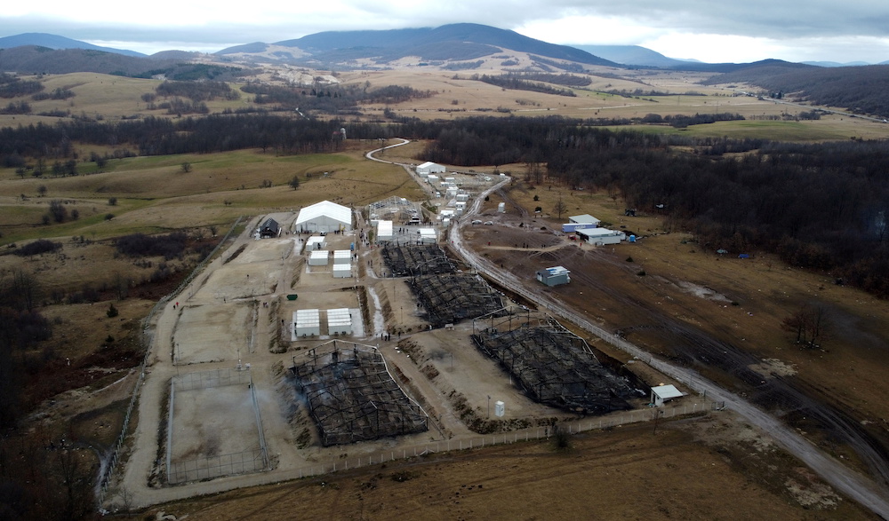 Remains of burnt tents are seen at the migrant center “Lipa” in Bihac, Bosnia and Herzegovina Dec. 24, 2020. Picture taken with a drone. (Reuters)