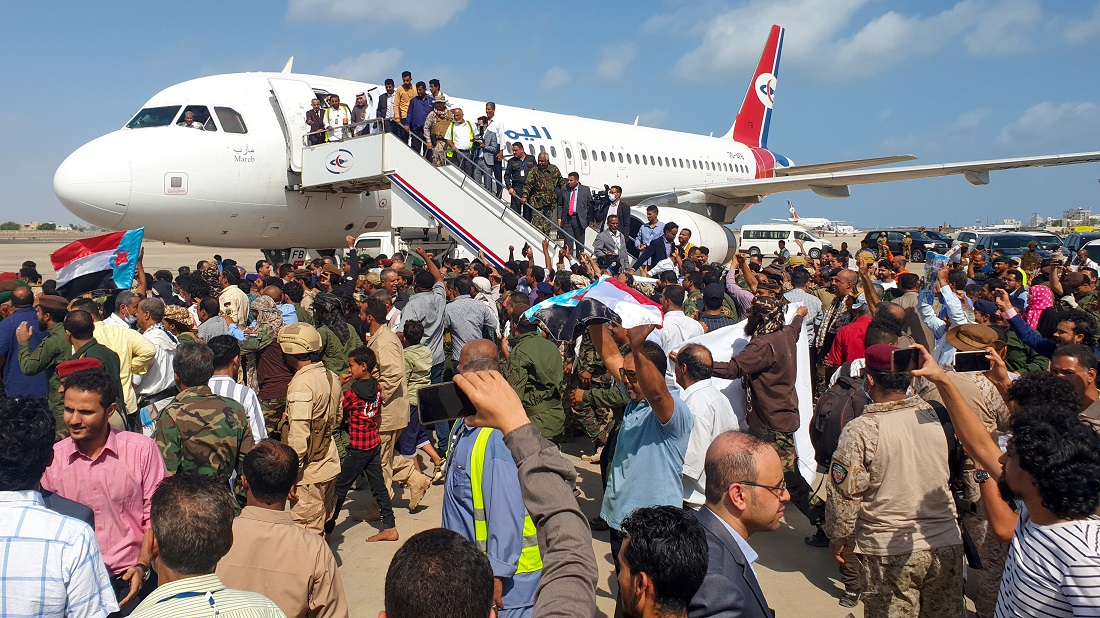 Crowds gathered on the runway as the passengers started to come off. (AFP)