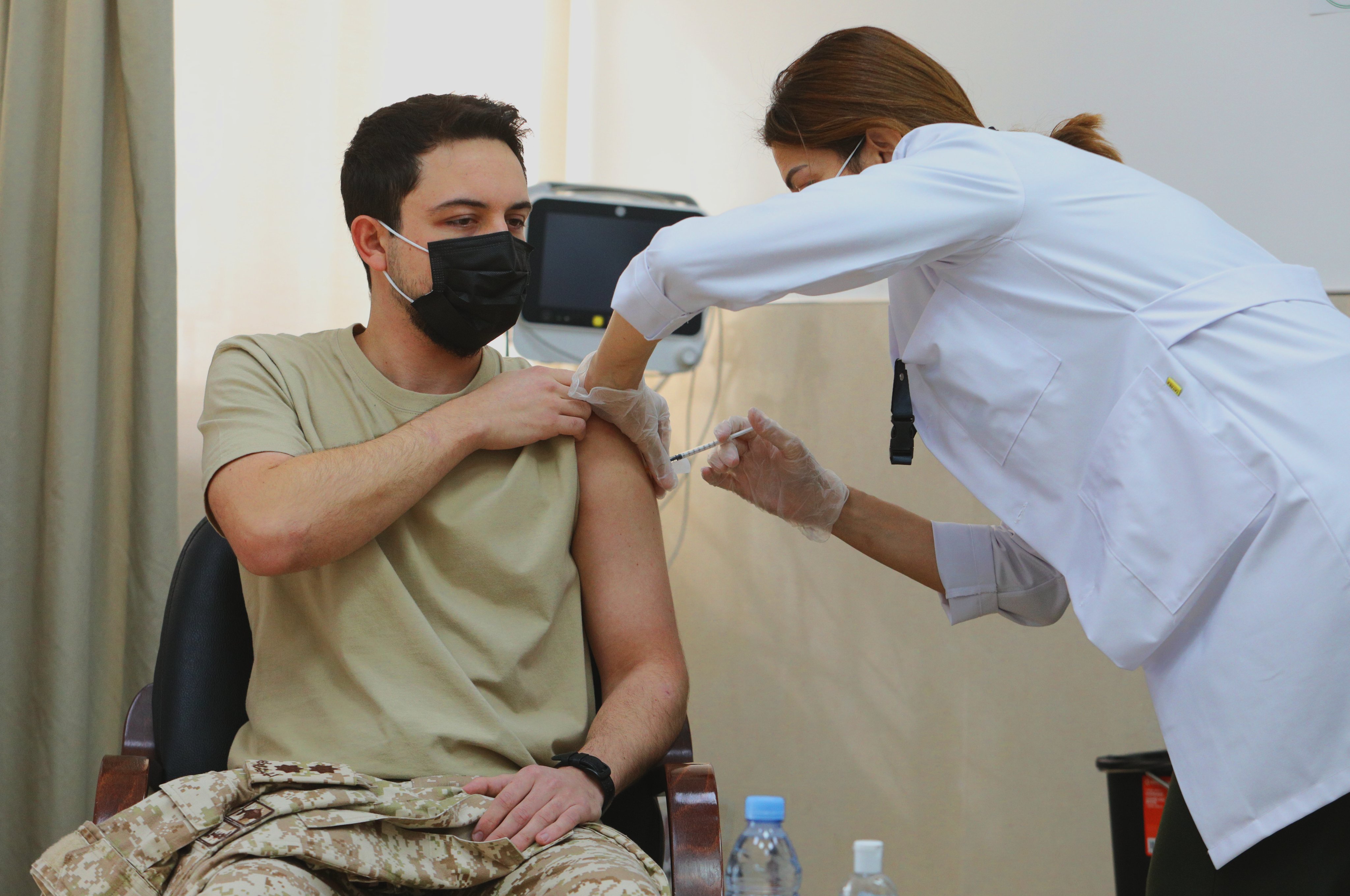 Jordan’s King Abdullah II was vaccinated alongside his son and Crown Prince Hussein and his uncle Prince Hassan in Amman on Jan. 14, 2021, the royal palace said. (Twitter/@RHCJO)