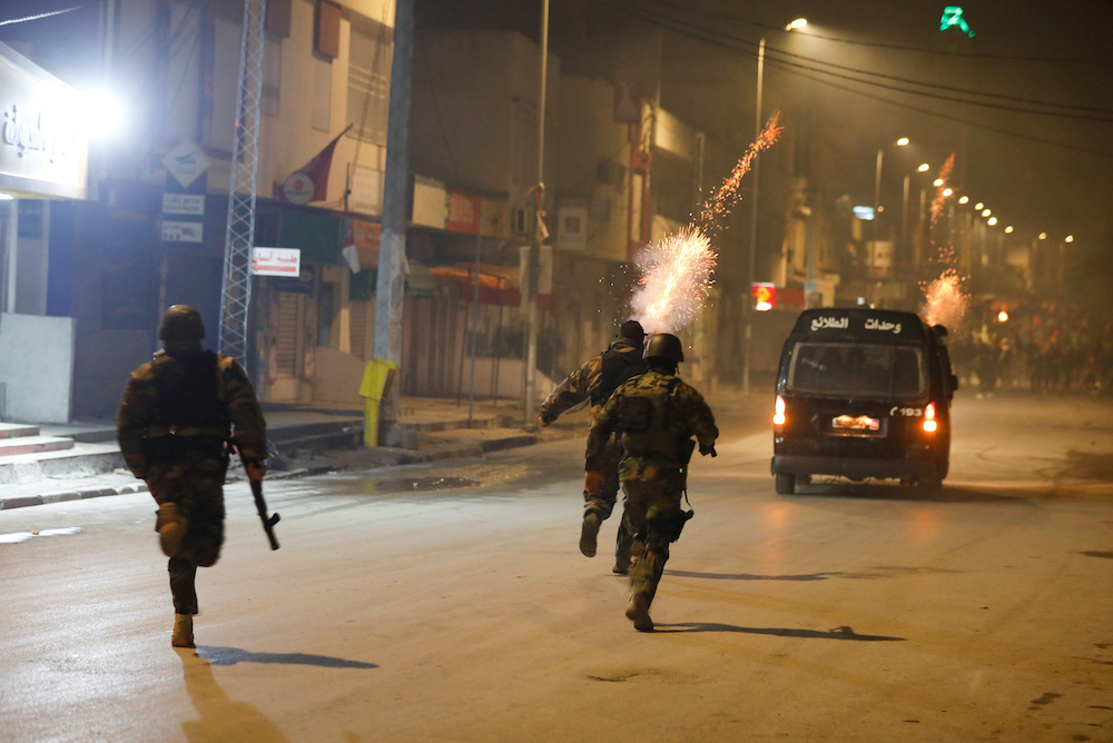 Security forces clash with demonstrators during anti-government protests in Tunis, Tunisia, Jan. 18, 2021. (Reuters)