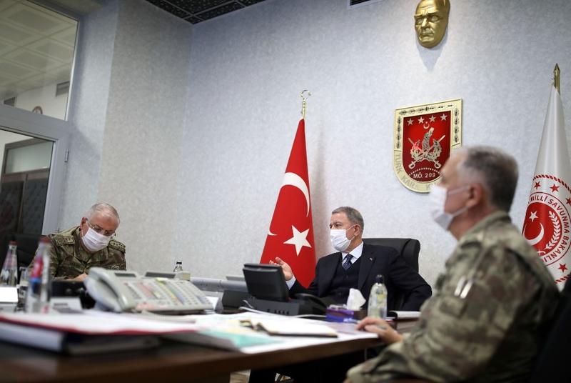 Turkish Minister of Defense Hulusi Akar, center, at Army Command Control Center in Ankara during the military operation dubbed Claw-Tiger against PKK elements in Iraqi Kurdistan, June 17, 2020. (AFP)