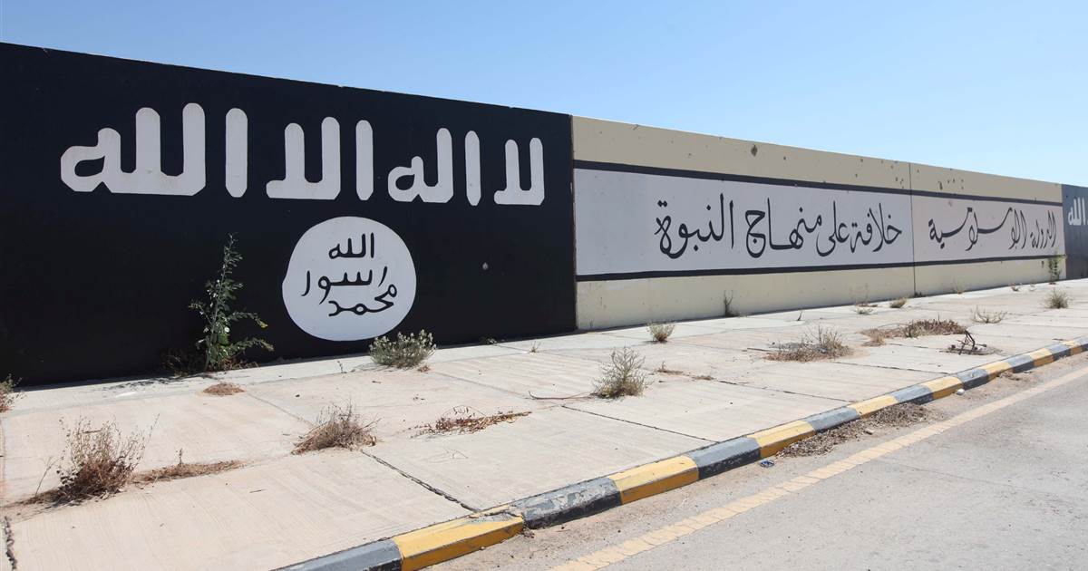 Daesh flags and slogans cover a wall in Sirte, Libya, in 2016. (File/Reuters)