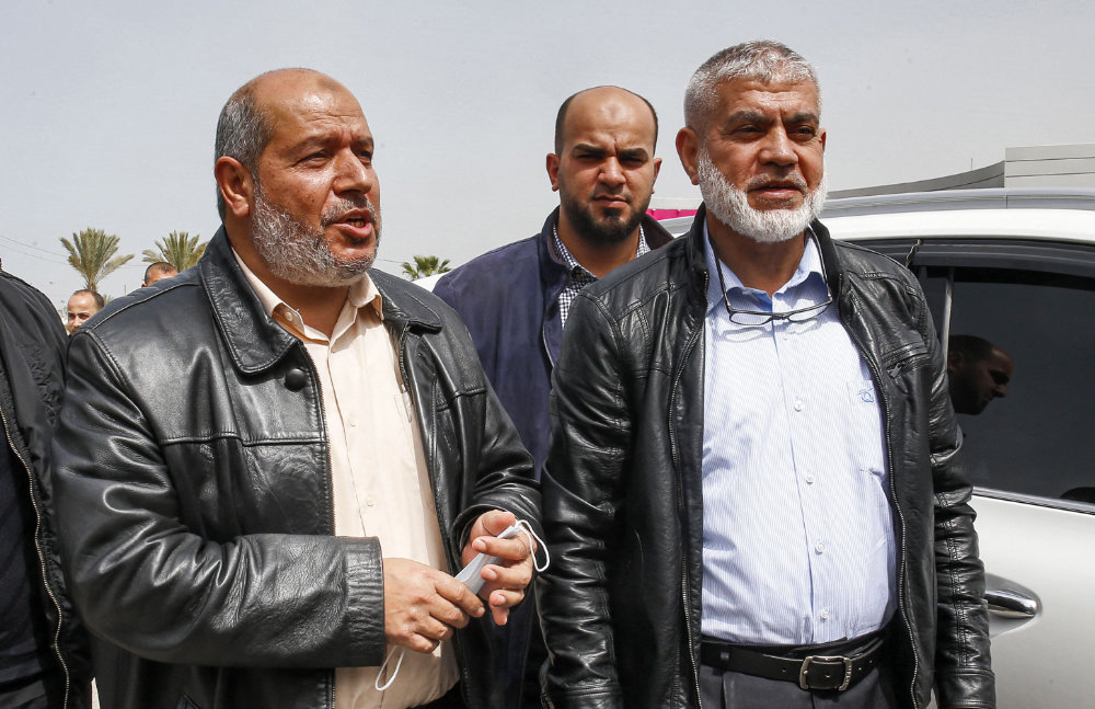 Khalil Al-Hayya and Ruwhi Mushtaha are the representatives of Hamas in the talks with Fatah on the Palestinian elections. (AFP / SAID KHATIB) 