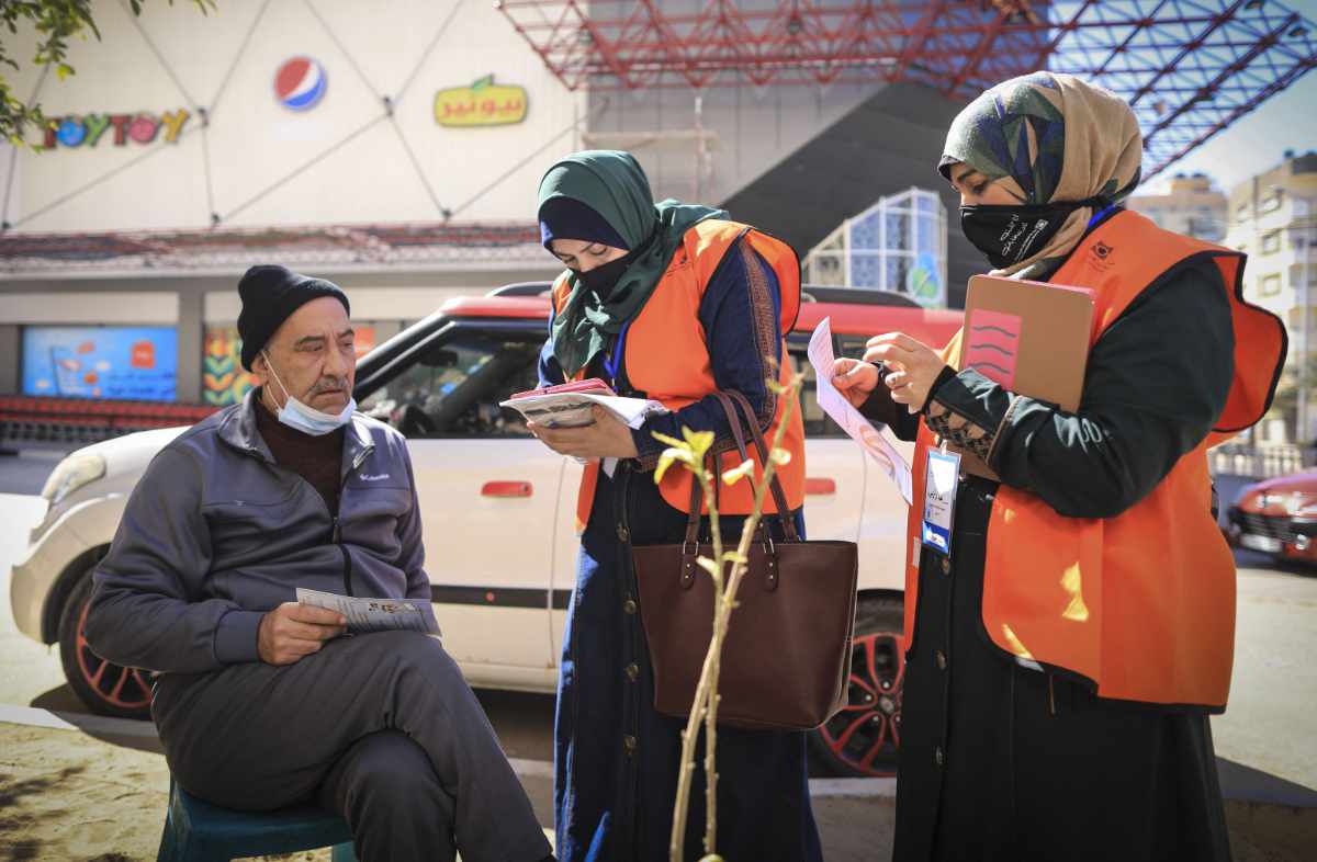 Palestinian members of Central Elections Commission register voters for the upcoming elections in Gaza City amid calls for a transparent democratic process. (File/AFP)