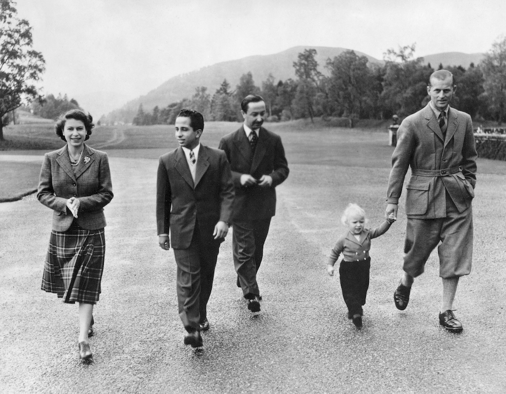 Picture taken on September 26, 1952 in Balmoral castle park showing Queen Elizabeth II walking along with her daughter Princess Ann (2nd R), Prince Philip (R), King Faisal II of Iraq (2nd L) and the regent of Iraq. (AFP/File Photo)