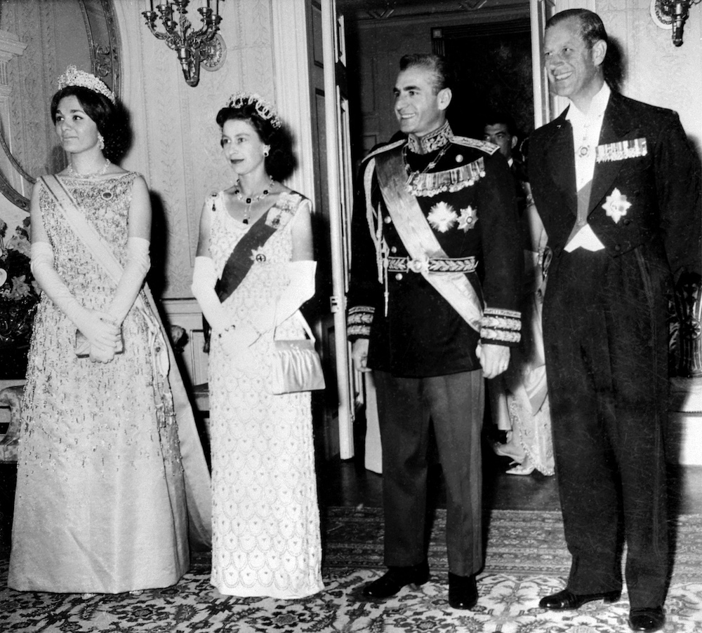 The Queen Elizabeth II and the Prince Philip pose with Iran Shah Mohammad Reza Pahlavi and his wife Farah Pahlavi during their state visit, March 1961 in Tehran. (AFP/File Photo)