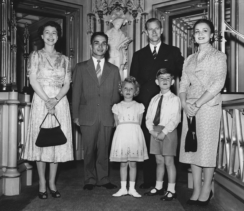 King Hussein of Jordan (2nd L) and his wife Queen Dina (R) pose with Queen Elizabeth II (L),  Prince Philip, Prince Charles and Princess Anne on June 19, 1955 at Windsor Castle. (AFP/File Photo)