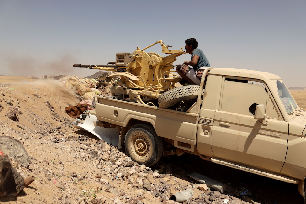 Yemeni government fighter fires a vehicle-mounted weapon at a frontline position during fighting against Houthi fighters in Marib last month. (Reuters/FIle)