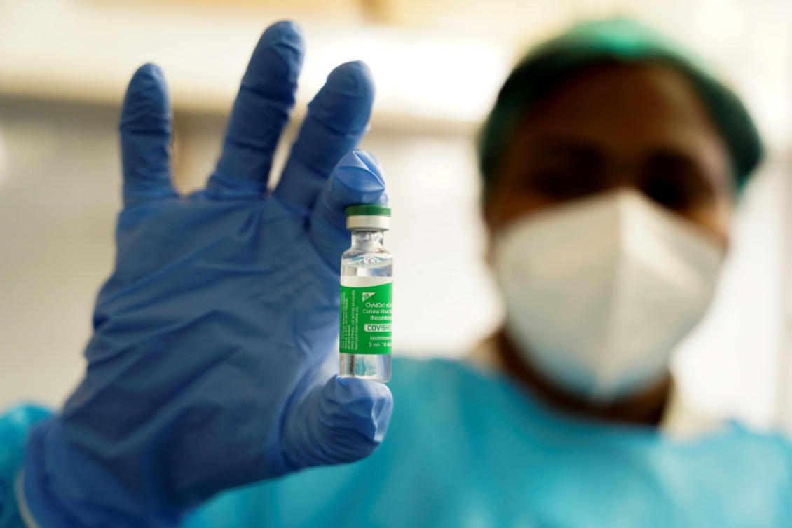 A nurse holds up a vial of the AstraZeneca COVID-19 vaccine at the Ngaliema Clinic in Kinshasa, Democratic Republic of Congo, on April 29, 2021. (REUTERS/Hereward Holland)