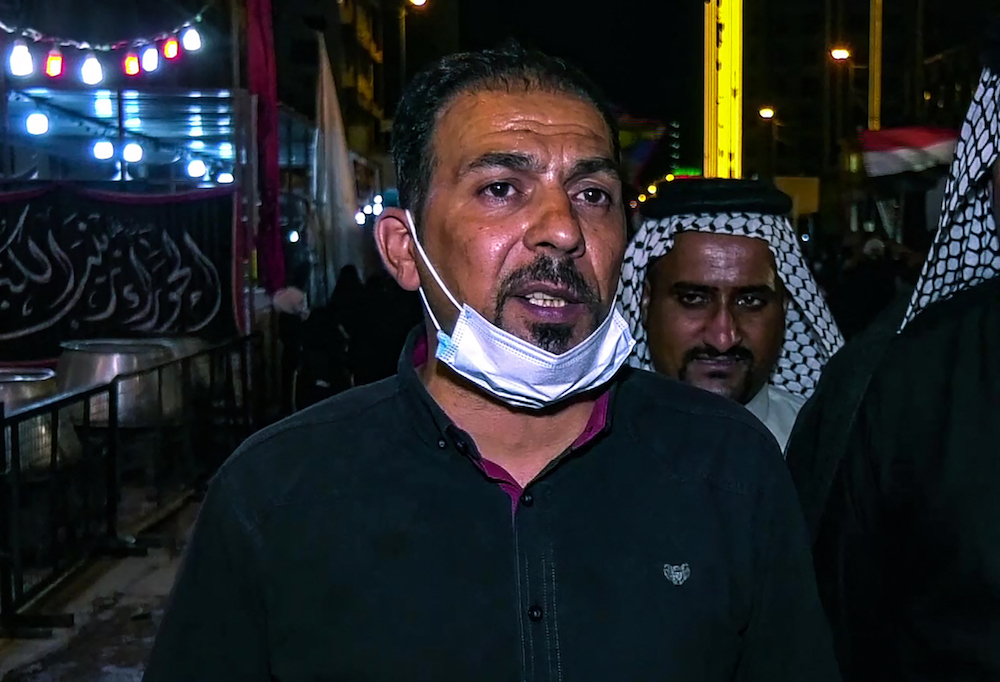 A grab from an AFPTV video taken on August 27, 2020, shows Iraqi activist Ihab al-Wazni, who was killed in 2020, sending supporters of a protest movement onto the streets to demand an end to bloodshed. (AFP/File Photo)