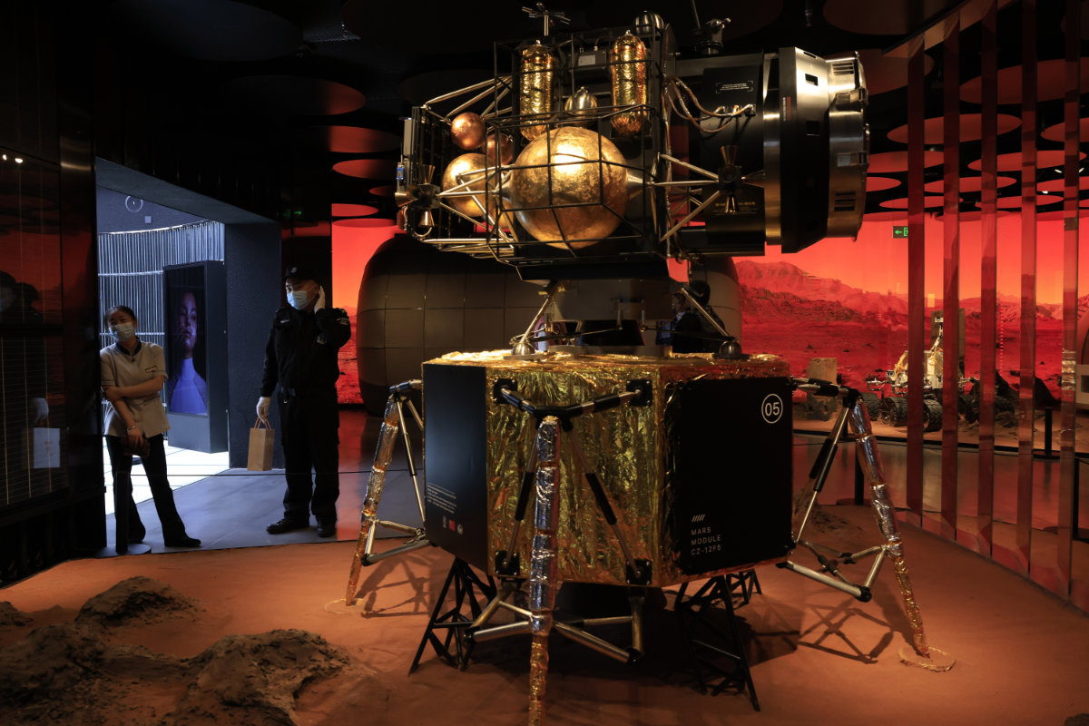 A Chinese lander is depicted in a Mars-like environment in Beijing on May 14, 2021. (AP Photo/Ng Han Guan)