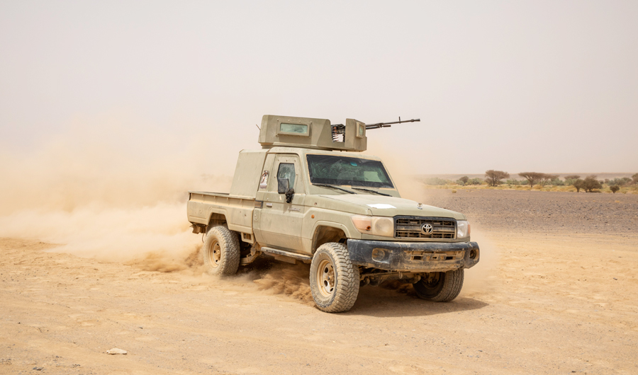 Yemeni fighters drive their armored vehicle on the Mass front line after clashes with Houthi rebels in Marib, Yemen, Saturday, June 19, 2021. (AP)