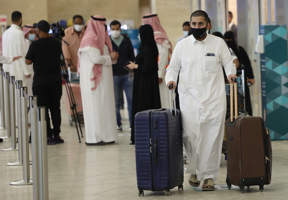 Saudi passengers arrive to King Khaled International airport in the capital Riyadh on May 17, 2021, as Saudi authorities lift travel restrictions for citizens immunised against COVID-19. (AFP/File Photo)