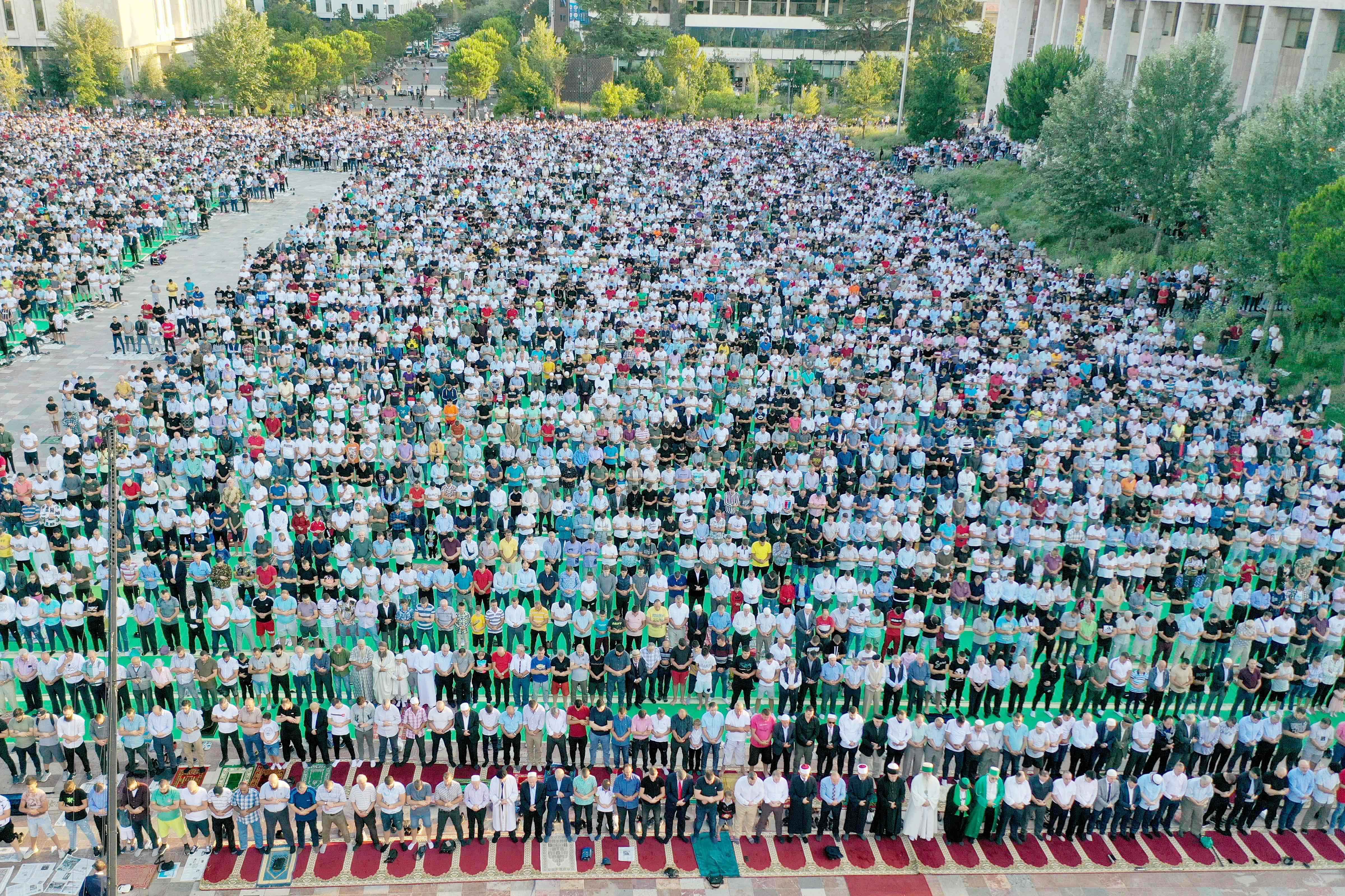 This aerial view shows Albanian Muslims attending the Eid Al-Adha prayer at Skenderbej Square in Tirana on July 20, 2021. (AFP)