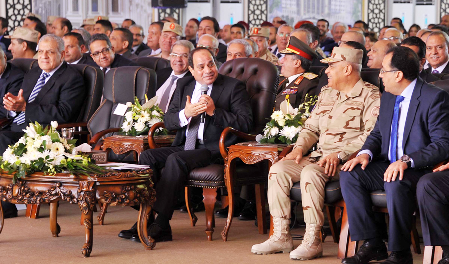 A handout picture released on March 1, 2018, shows Egyptian President Abdel Fattah al-Sisi (C) attending the inauguration of the "New El Alamein" city in western Egypt. (AFP)