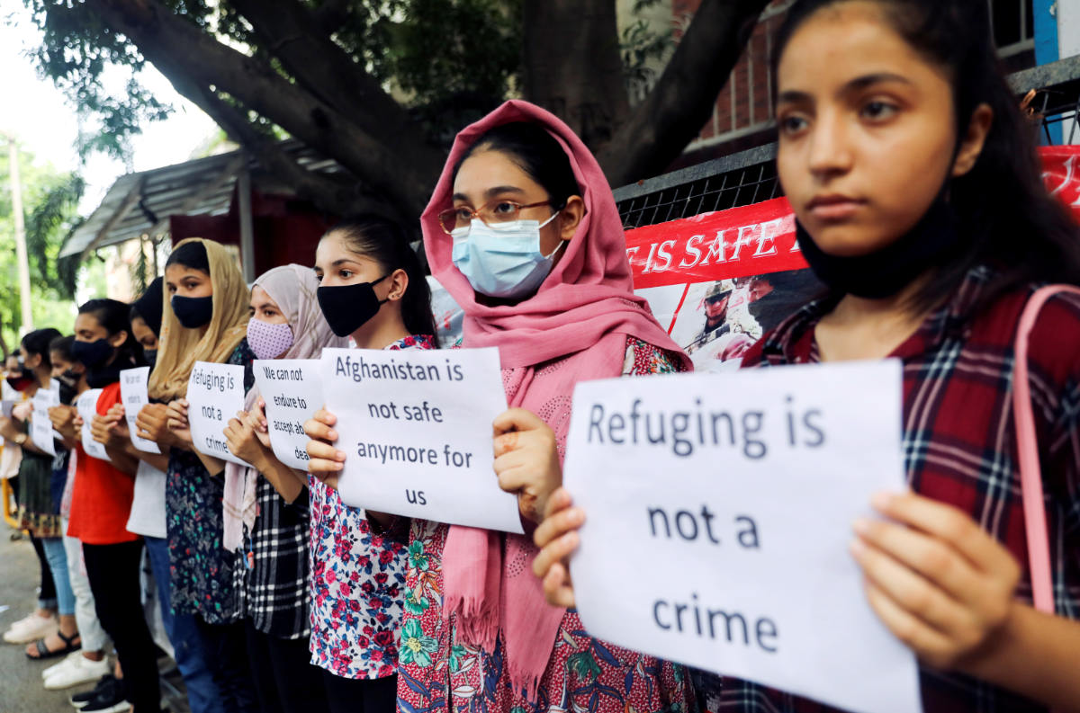 Afghan nationals protest outside the United Nations High Commissioner for Refugees (UNHCR) office to urge the international community to help Afghan refugees, in New Delhi, India, August 26, 2021. (REUTERS)