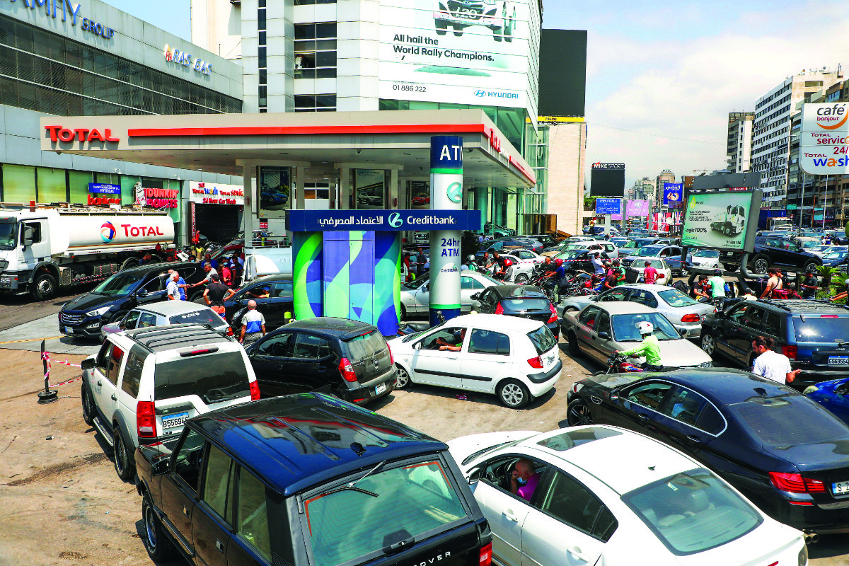 People queue for fuel at a gas station in Zalka, Lebanon, earlier this month. Fuel has become the latest casualty of a complex web of crises that have drained Lebanon’s foreign currency reserves. (Reuters)