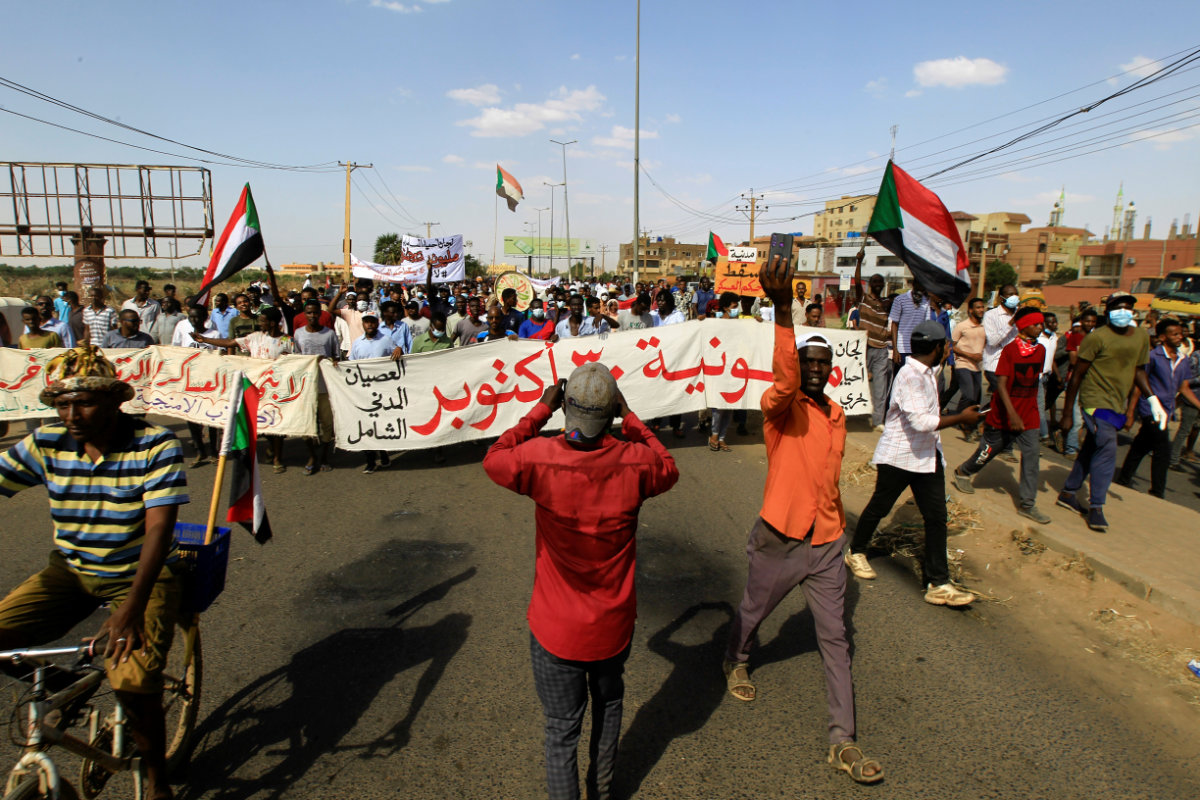 Protesters march in Khartoum on Oct. 30, 2021, against the Sudanese military's recent seizure of power and ousting of the civilian government. (REUTERS/Mohamed Nureldine)