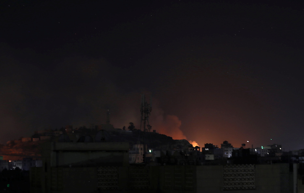 Smoke rises from the site of Saudi-led air strikes in Sanaa, Yemen November 27, 2021. REUTERS/Khaled Abdullah