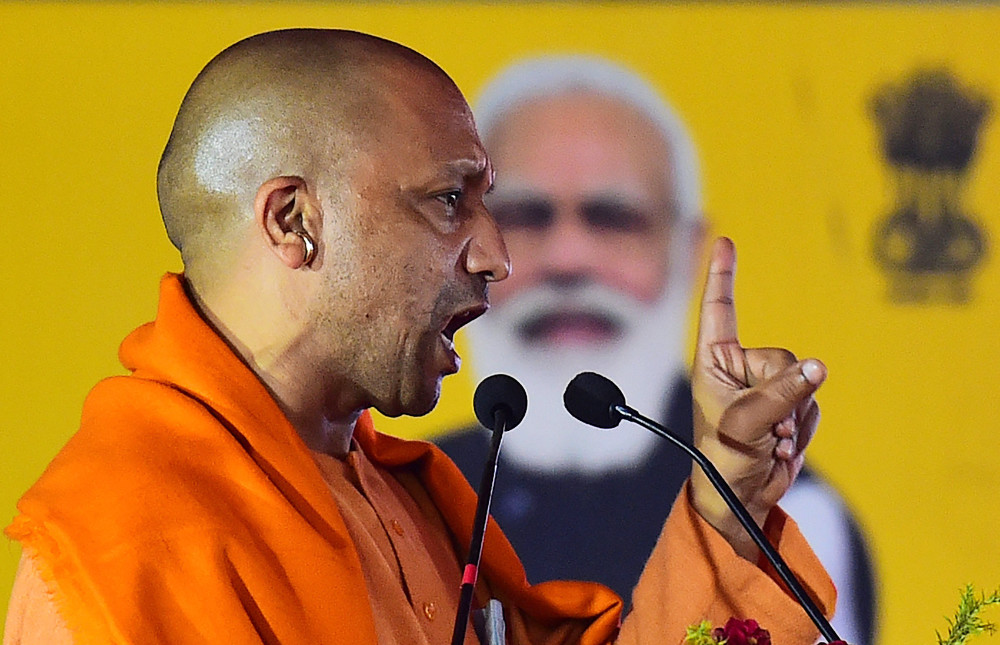 The Hindu Bharatiya Janata Party leader Yogi Adityanath addresses a public rally in Allahabad on December 26, 2021. (AFP)