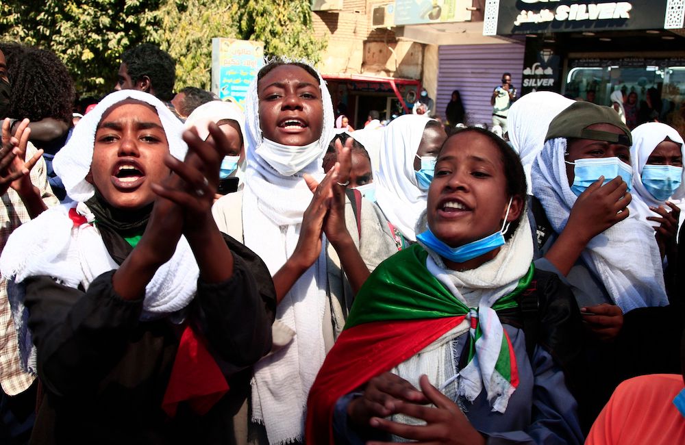 Sudanese demonstrators chant slogans during a protest demanding civilian rule in the “Street 40” of the Sudanese capital’s twin city of Omdurman on Jan. 4, 2022. (AFP)