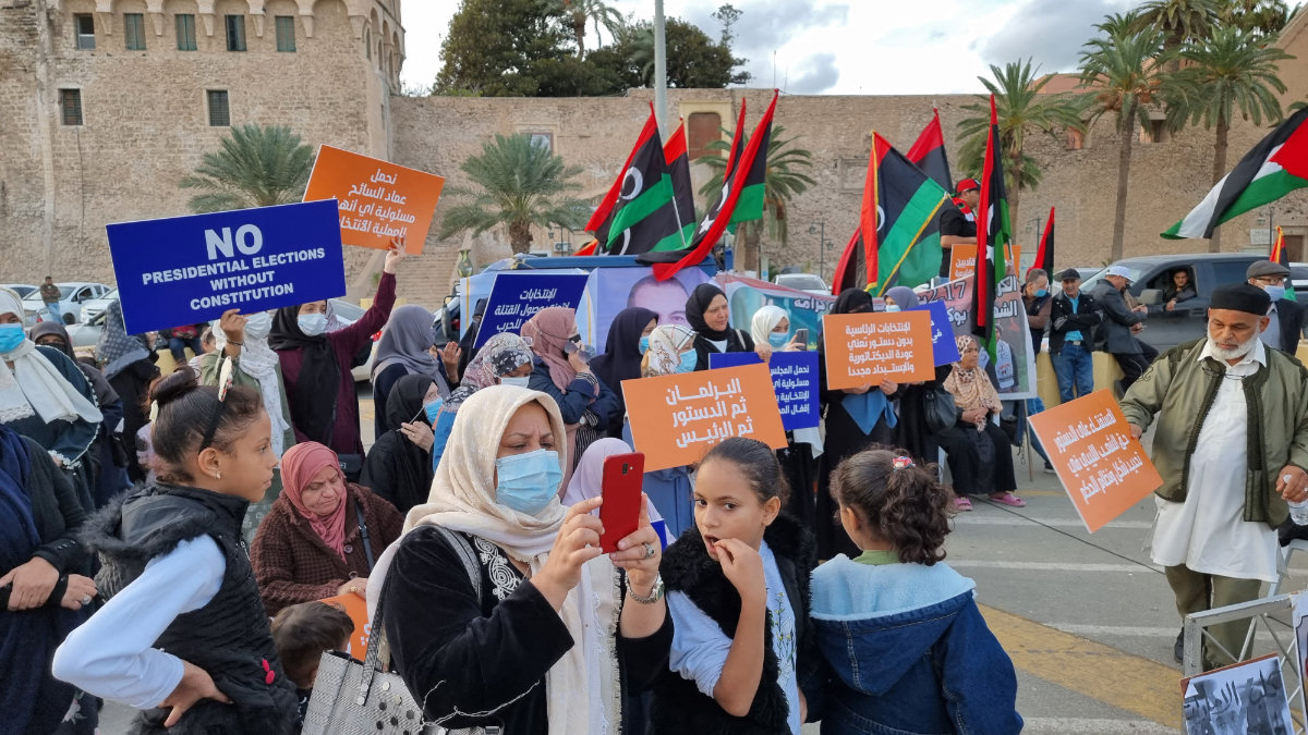 Libyans protest at Martyrs’ Square in the capital Tripoli after Saif Al-Islam Qaddafi, son of former dictator Muammar Qaddafi, announced his candidacy in the upcoming presidential election. (AFP)