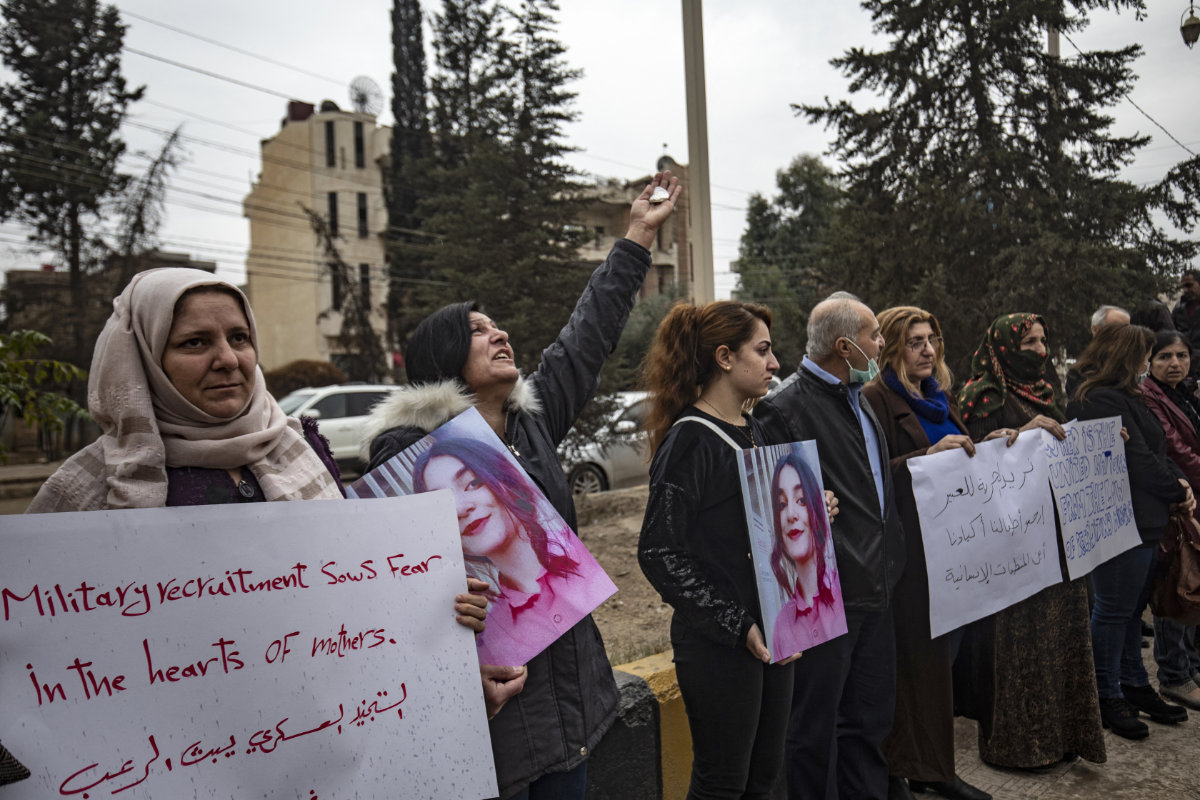 Demonstrators call for the release of young girls they say were abducted into fighting for the YPG. (AFP)