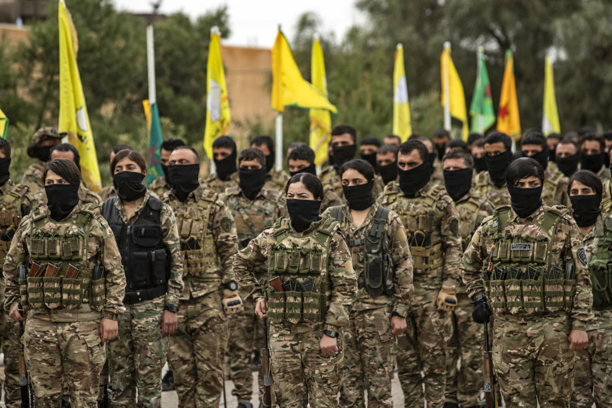 SDF fighters take part in a military parade in the US-protected Al-Omar oil field in the eastern province of Deir Ezzor on March 23, 2021. (AFP file)