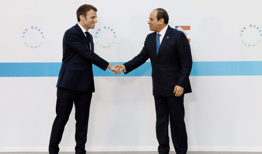 France's President Emmanuel Macron (L) welcomes Egypt' President Abdel Fatah al-Sissi (R) before the Hight Level Segment session of the One Ocean Summit in the northwestern France port city of Brest on Feb. 11, 2022. (AFP)