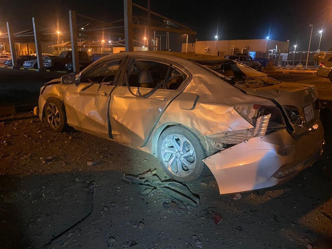 Saudi firefighters inspect damage caused by the debris of a missile intercepted in Jazan on Saturday. (SPA)