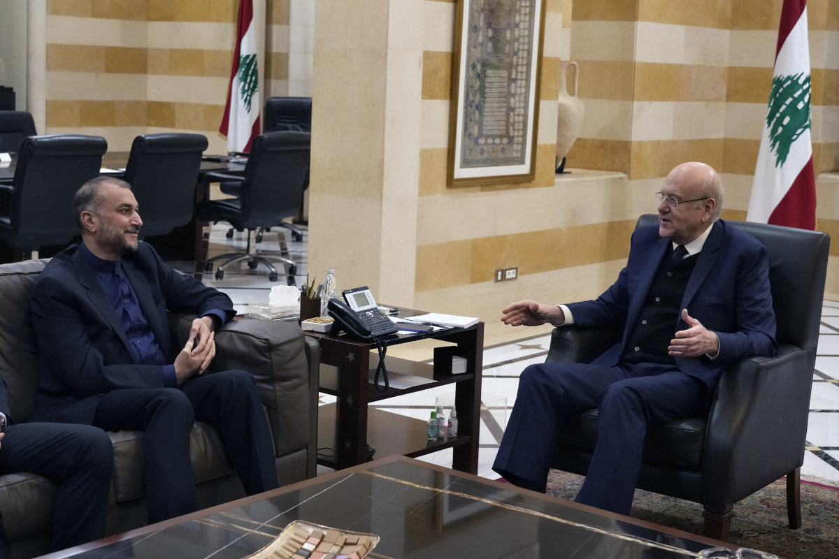 Lebanese Prime Minister Najib Mikati, right, meets with Iran's Foreign Minister Hossein Amir-Abdollahian in Beirut, Lebanon, on March 24, 2022, just hours after meeting with envoys from the Gulf states. (AP Photo/Bilal Hussein)