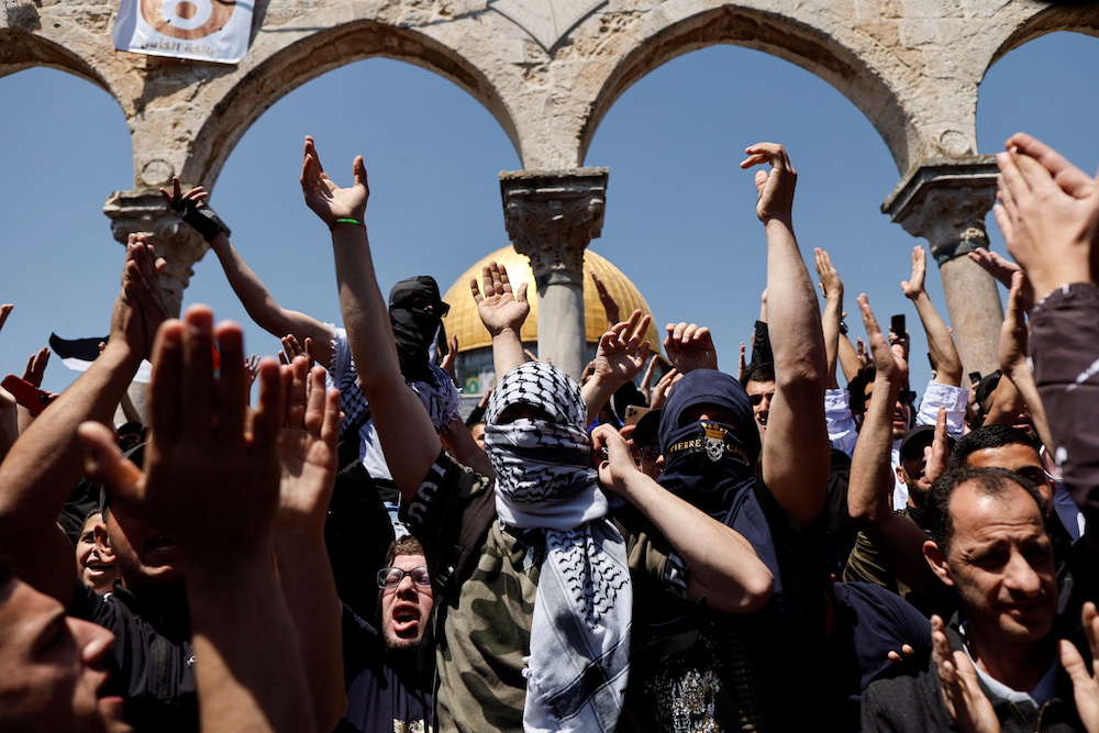 Palestinians shout slogans at the compound that houses Al-Aqsa Mosque, known to Muslims as Noble Sanctuary and to Jews as Temple Mount, following clashes with Israeli security forces in Jerusalem's Old City. (Reuters)n Jerusalem's Old City. (Reuters)