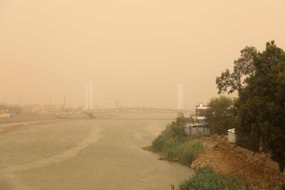 An aerial picture shows a view of the Iraqi city of Nasiriyah in the southern Dhi Qar province during a sandstorm, on May 1, 2022. (AFP)