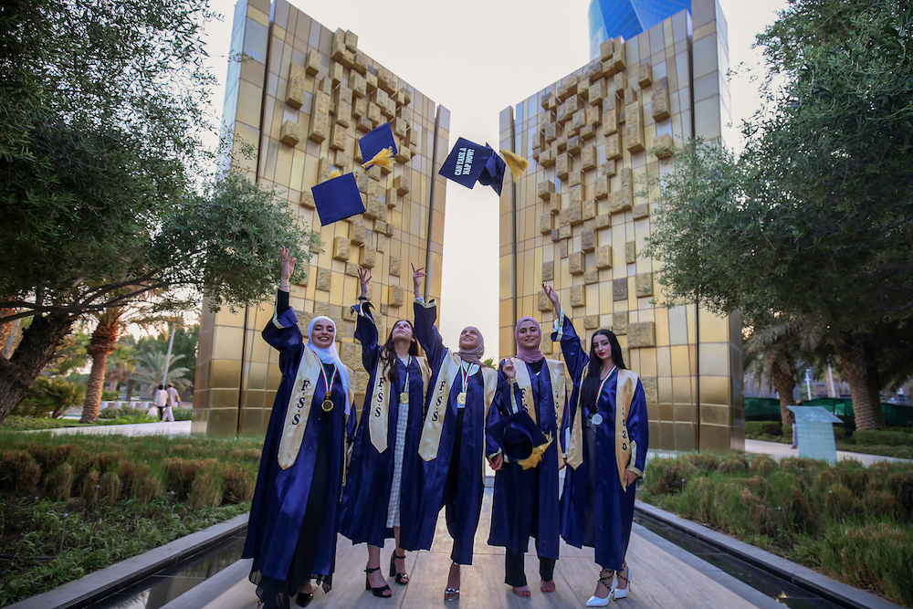 Kuwaiti students celebrate graduation amid regional concerns about skills shortages among teaching staff. (AFP)