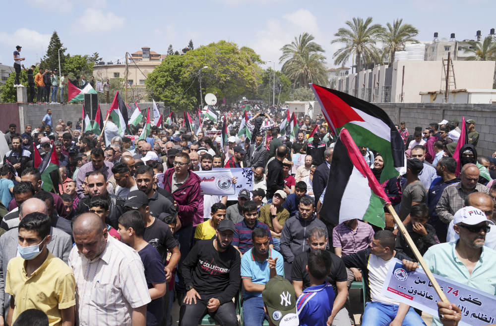 Palestinians take part in a rally in Gaza City on Sunday, marking the 74h anniversary of what the Palestinians call the Nakba — referring to their uprooting in the war over Israel’s 1948 creation. (AP)