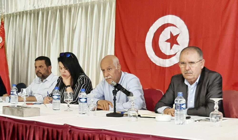 Noureddine Taboubi (R), Secretary-General of the Tunisian General Labour Union (UGTT), chairs the meeting of the body's national administrative commission in Hammamet on May 23, 2022. (AFP)