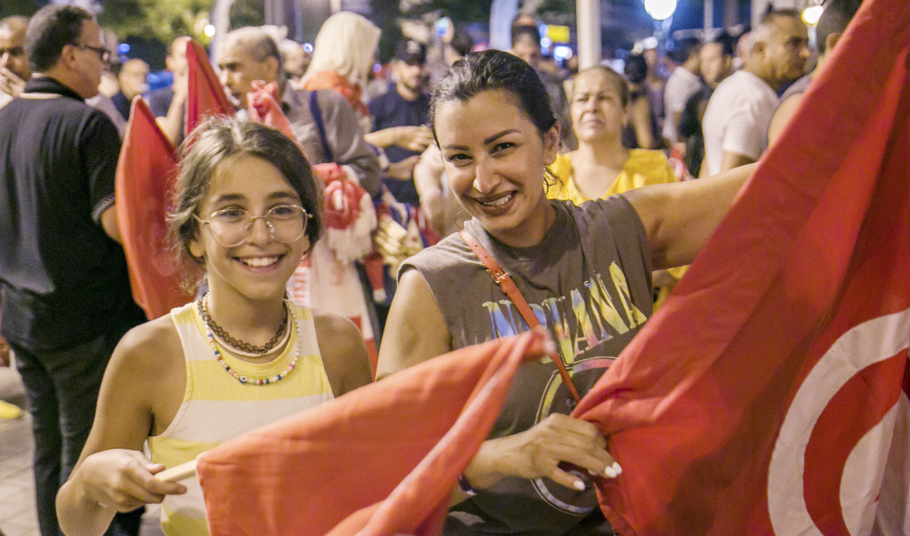 Supporters of President Kais Saied celebrate referendum results. (AP)