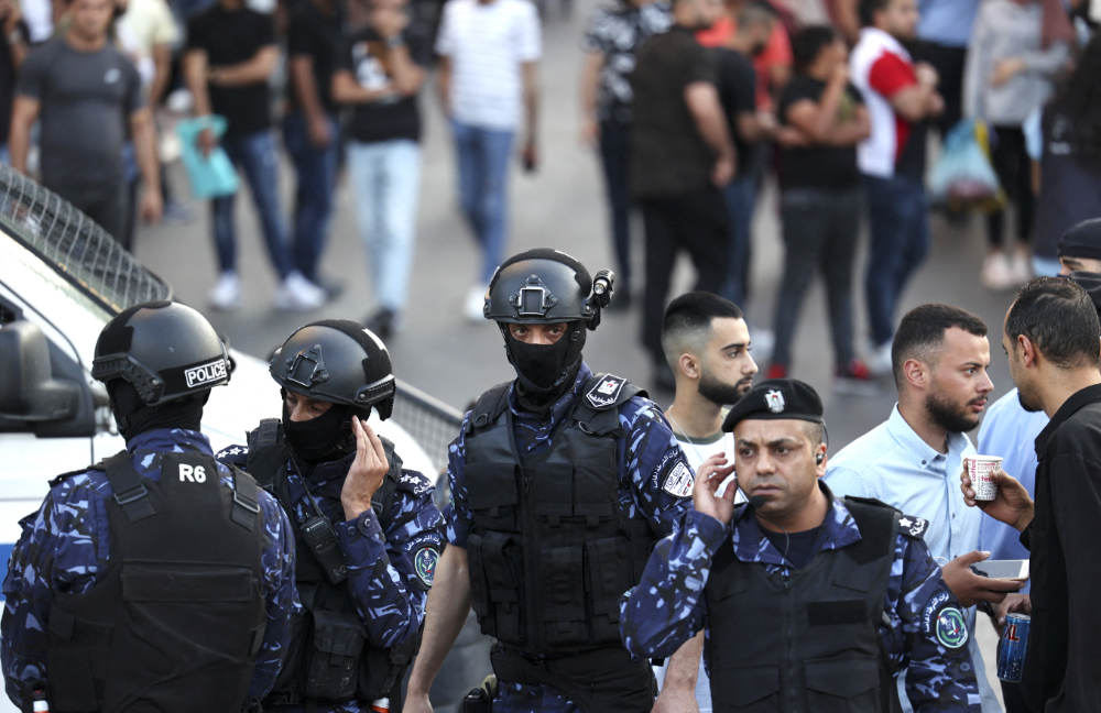 Palestinian police prevent demonstrators from gathering ahead of a planned protest against the Palestinian authority in the West Bank city of Ramallah. (AFP file photo)