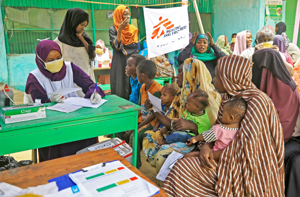 People who fled ethnic clashes in Sudan’s Blue Nile state wait at a clinic at a camp for displaced people in Damazin, some 450 km south of Khartoum. (AFP file photo)