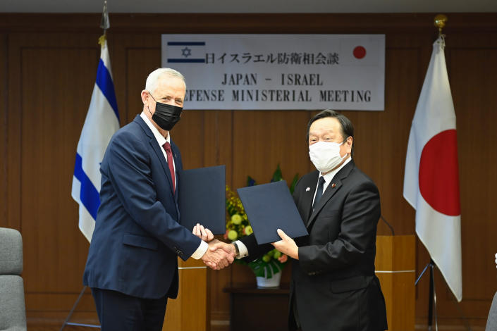 Israeli Defense Minister Benny Gantz, left, and his Japanese counterpart Yasukazu Hamada agree to strengthen defense cooperation at a meeting in Tokyo. The deal comes as Japan looks to step up its role in the Mideast peace process. (AP)