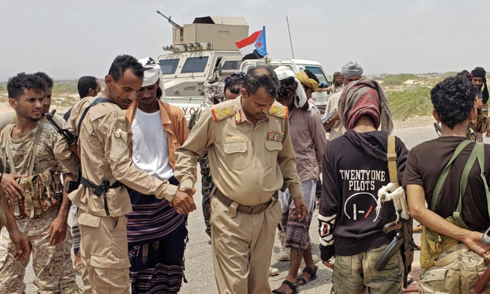 Brigadier General Abu Bakr Hussein Salem, third left, the governor of Abyan, inspects the bodies of al-Qaeda fighters killed during an attack on a security checkpoint on Sept. 6. (AFP)