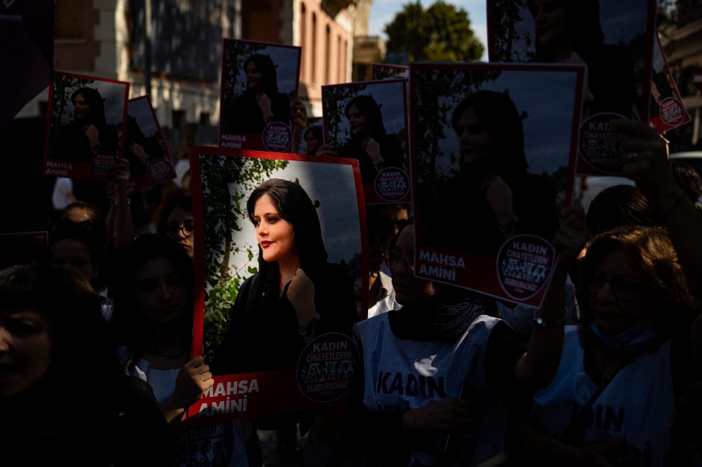 Protests have erupted in over 80 cities and towns across the country with women at the forefront, waving hijabs, hurling them in bonfires and chopping off their hair. (AFP)