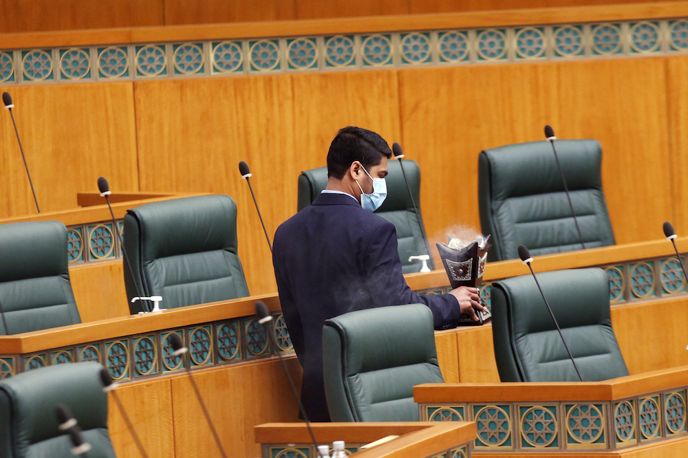 A worker burns incense just before the start of a parliamentary session at the National Assembly’s Abdullah Al-Salem Hall in Kuwait City. (File/AFP)