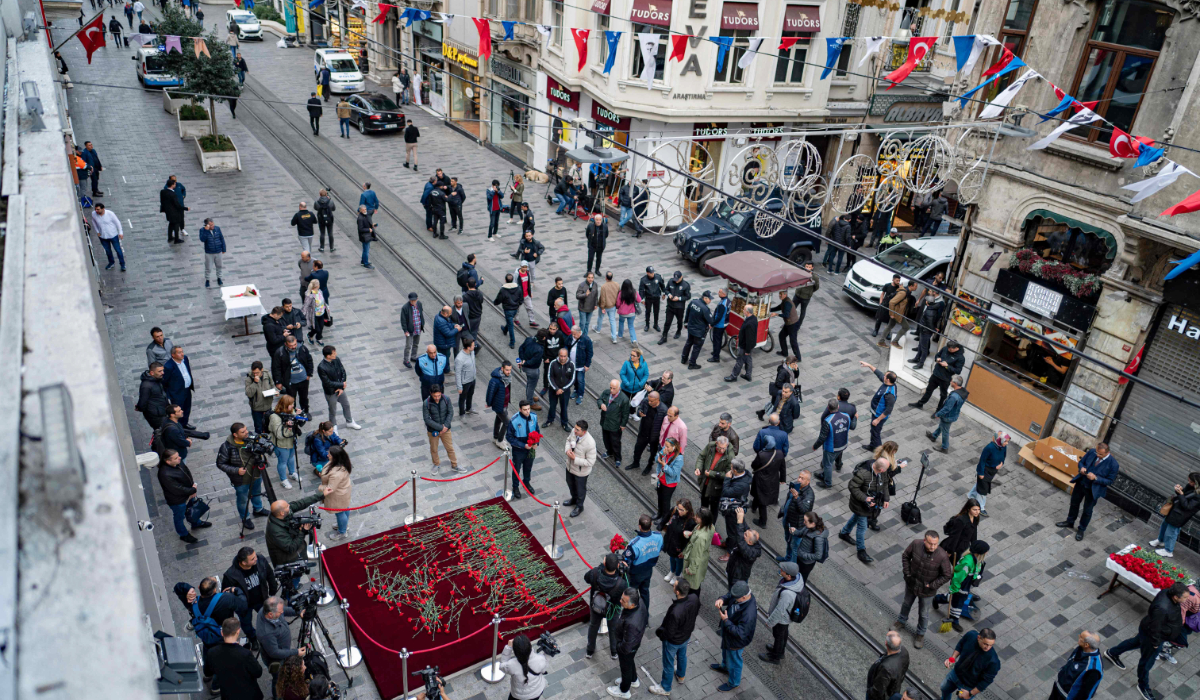 People mourn the victims of November 13 explosion at the busy shopping street of Istiklal in Istanbul on November 14, 2022. (AFP)