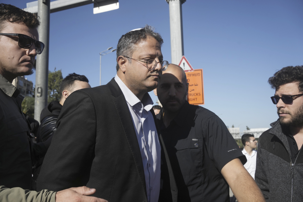 Israeli far-right lawmaker Itamar Ben-Gvir arrives at the scene of an explosion at a bus stop in Jerusalem, Wednesday, Nov. 23, 2022. (AP)
