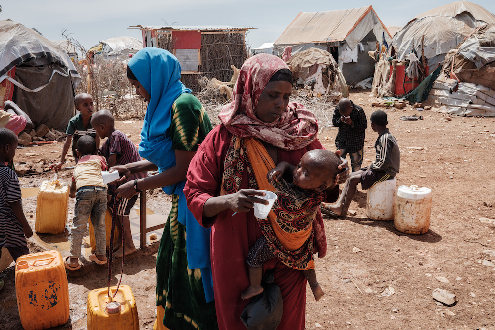 A mother gives her child water at a camp in drought-ravaged Somalia. (AFP)