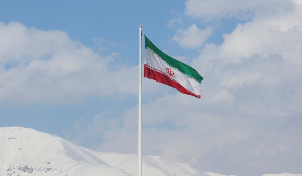 The Iranian flag is seen flying over a street in Tehran, Iran, February 1, 2023. (REUTERS)