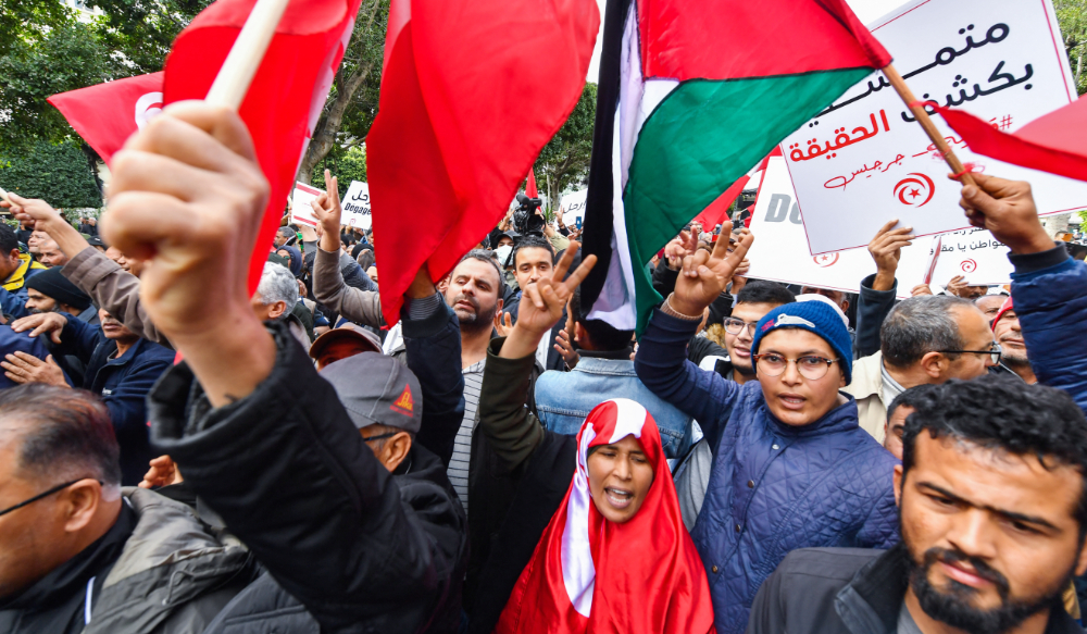 Tunisian demonstrators take part in a rally against President Kais Saied, called for by the opposition "National Salvation Front" coalition, in the capital Tunis, on December 10, 2022. (AFP)